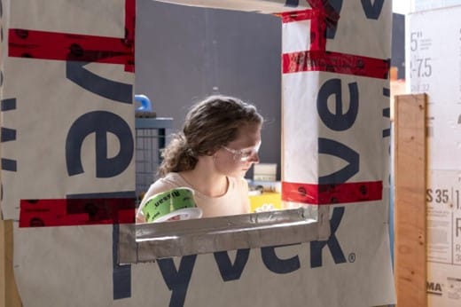 Person working with construction materials